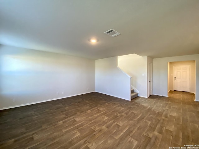 unfurnished room featuring dark hardwood / wood-style floors