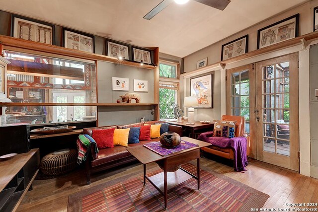 living room featuring french doors, hardwood / wood-style flooring, and ceiling fan