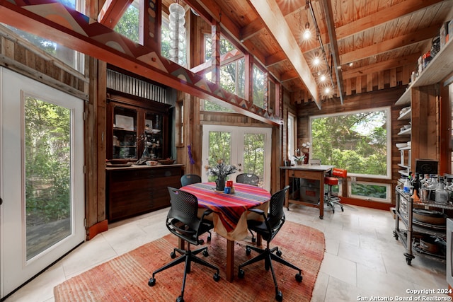 sunroom with plenty of natural light, beamed ceiling, and wooden ceiling