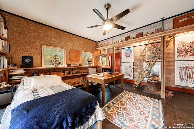 bedroom with dark hardwood / wood-style flooring, ceiling fan, and a closet