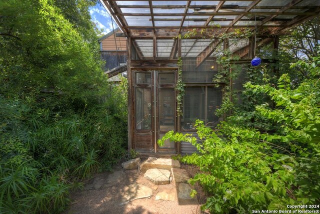 back of house featuring french doors