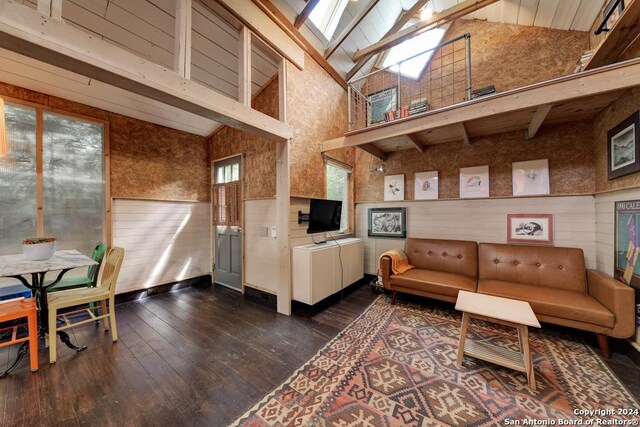 bathroom with toilet, an enclosed shower, wooden walls, wood ceiling, and beam ceiling