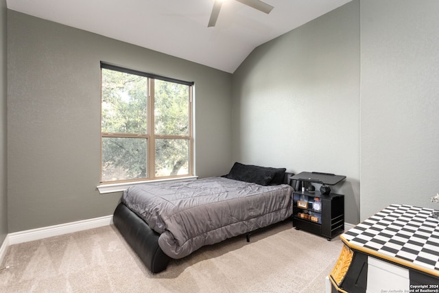 carpeted bedroom featuring ceiling fan and lofted ceiling