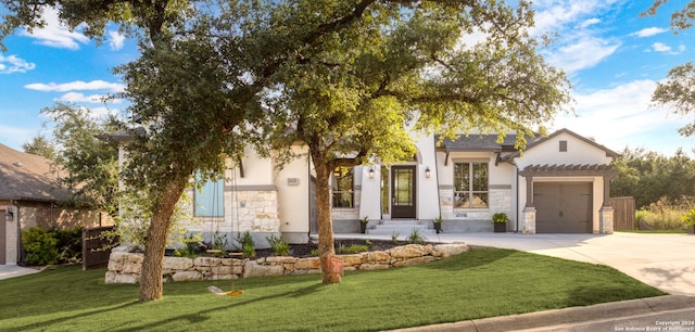 view of front facade with a garage and a front yard