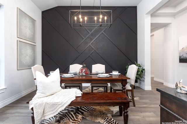 interior space with hardwood / wood-style flooring and an inviting chandelier