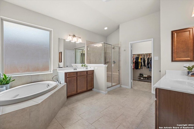 bathroom featuring tile patterned floors, vanity, and separate shower and tub