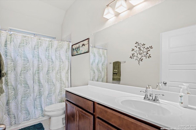 bathroom with vanity, tile patterned floors, and toilet