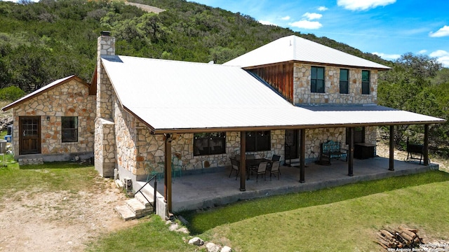 rear view of property with a patio