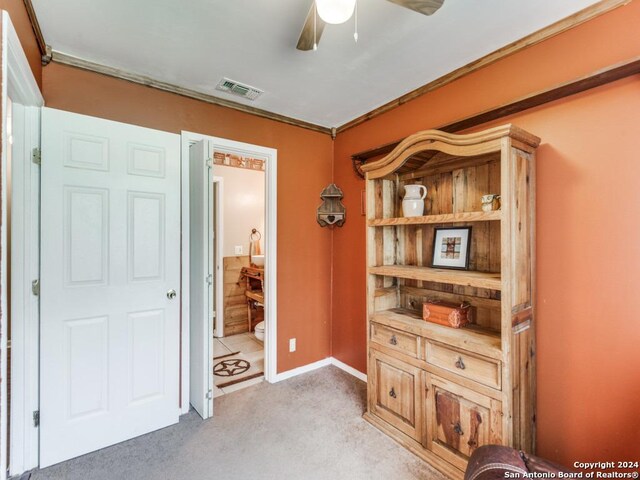 interior space with ceiling fan