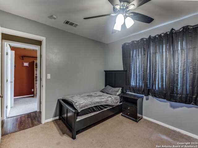 carpeted bedroom with ceiling fan