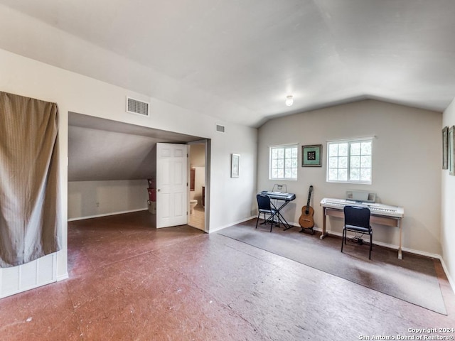 office space with lofted ceiling, visible vents, and baseboards