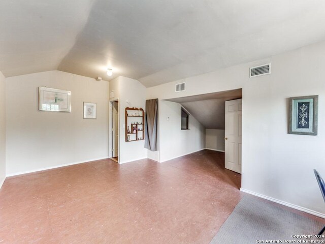 interior space featuring vaulted ceiling