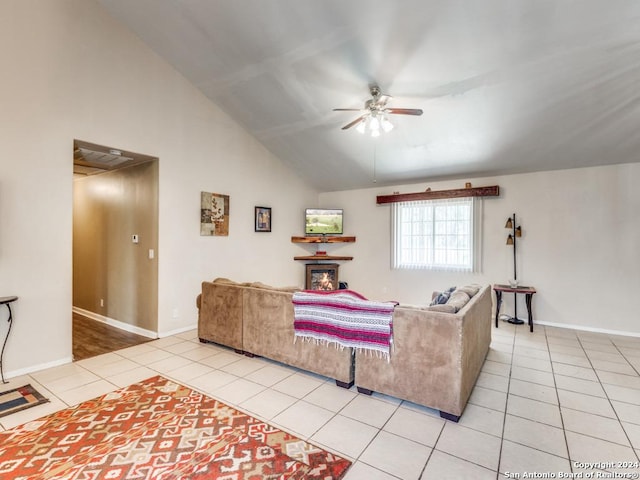 living room featuring high vaulted ceiling, ceiling fan, baseboards, and light tile patterned flooring