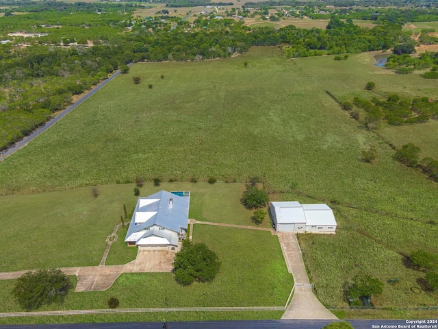 birds eye view of property with a rural view