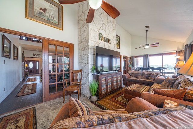 living room with dark hardwood / wood-style flooring, ceiling fan, and high vaulted ceiling