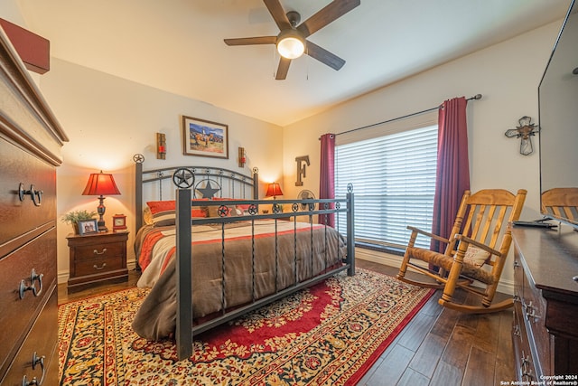 bedroom with ceiling fan and hardwood / wood-style flooring