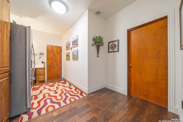 corridor featuring dark hardwood / wood-style floors