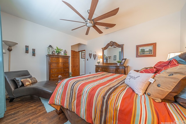 bedroom with dark hardwood / wood-style floors and ceiling fan