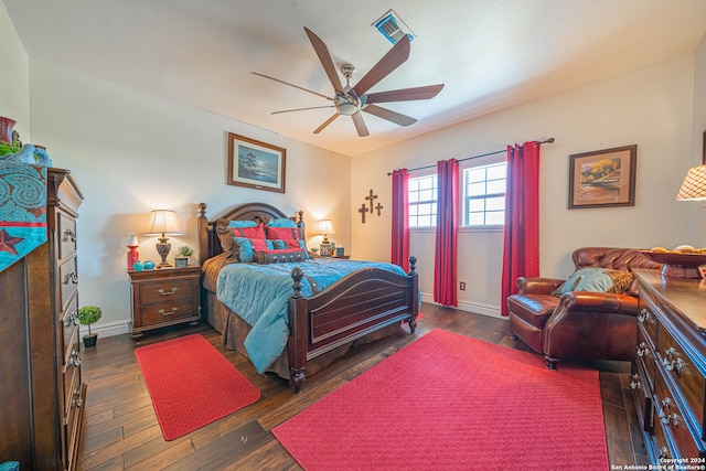 bedroom with dark wood-type flooring and ceiling fan