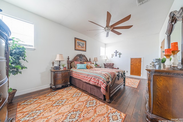 bedroom featuring dark hardwood / wood-style flooring and ceiling fan