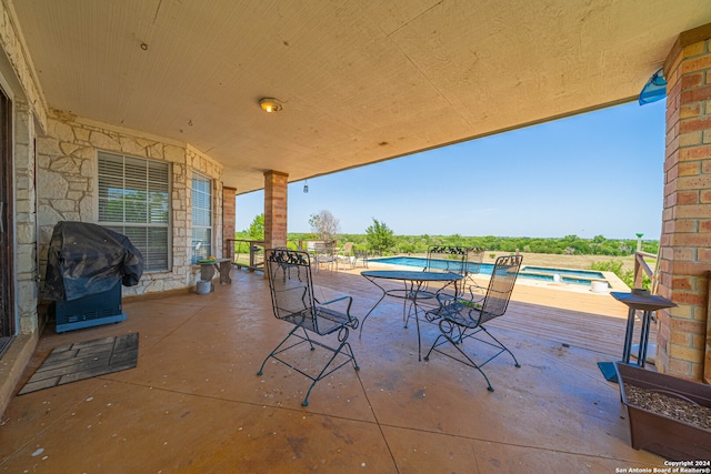 view of patio with a grill