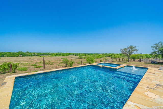 view of pool featuring an in ground hot tub