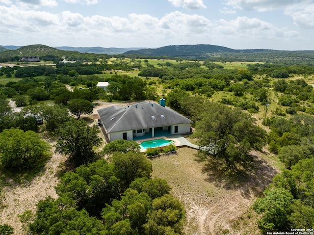 birds eye view of property with a mountain view