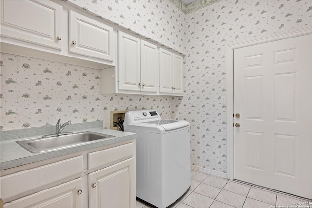 laundry room with washer / clothes dryer, sink, cabinets, and light tile patterned flooring