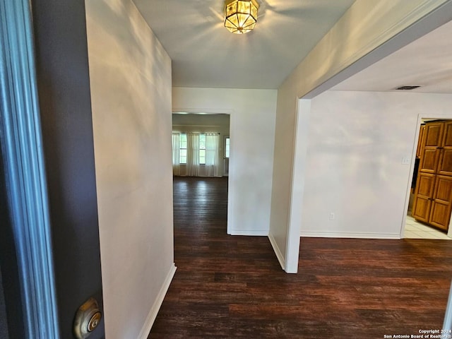 hall with hardwood / wood-style floors