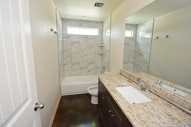 full bathroom with a textured ceiling, a textured wall, and baseboards