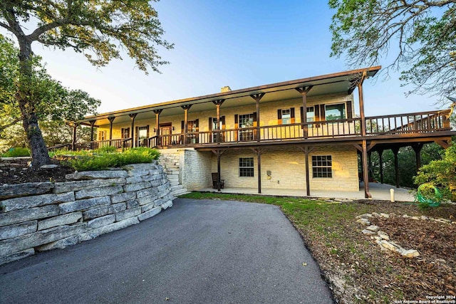 back of property featuring a patio area