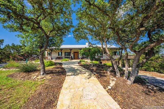 ranch-style home with covered porch