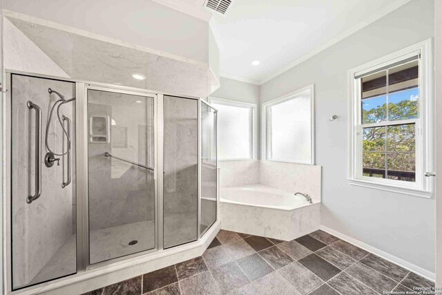 bathroom with tile patterned floors, separate shower and tub, and crown molding