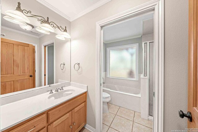 bathroom featuring tile patterned floors, toilet, vanity, and ornamental molding