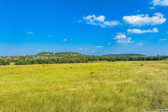 mountain view featuring a rural view