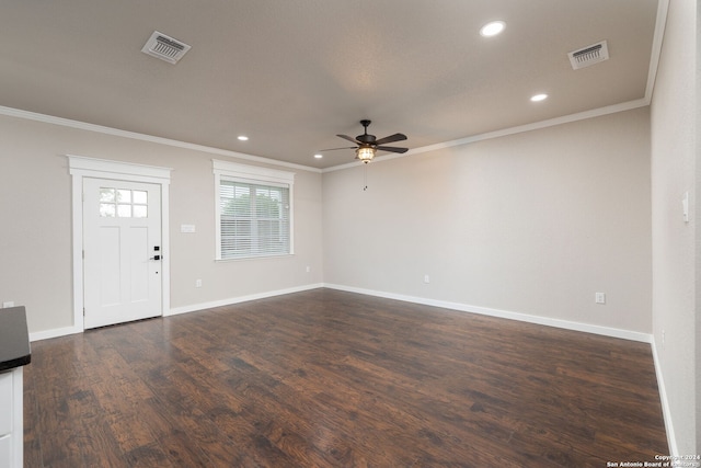 foyer with dark hardwood / wood-style flooring, ceiling fan, and ornamental molding