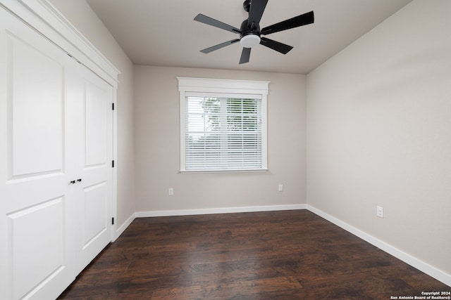 unfurnished bedroom with a closet, ceiling fan, and dark hardwood / wood-style flooring