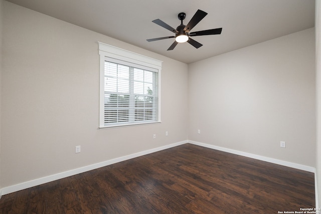 empty room featuring dark hardwood / wood-style floors and ceiling fan