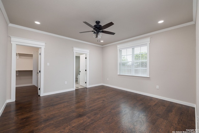 unfurnished room with ceiling fan, dark wood-type flooring, and ornamental molding