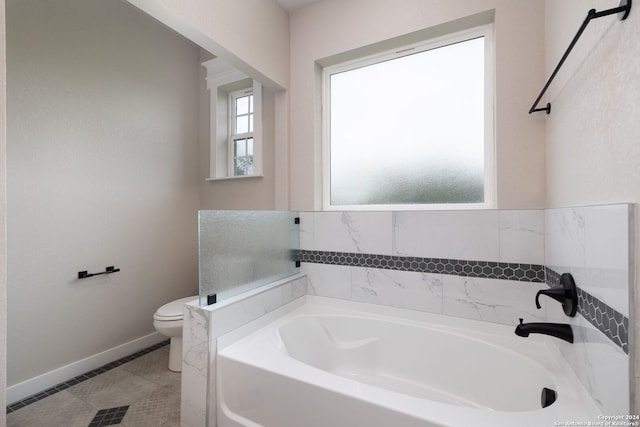 bathroom featuring a bath, toilet, and tile patterned floors