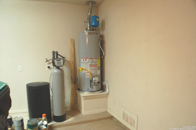 utility room with water heater