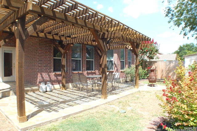 view of patio featuring a pergola