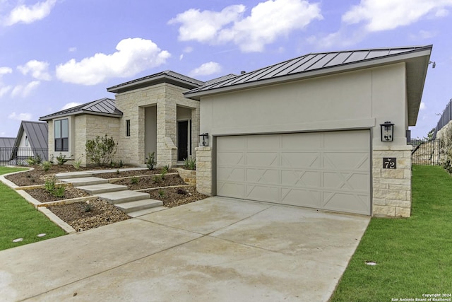 view of front facade with a garage and a front lawn