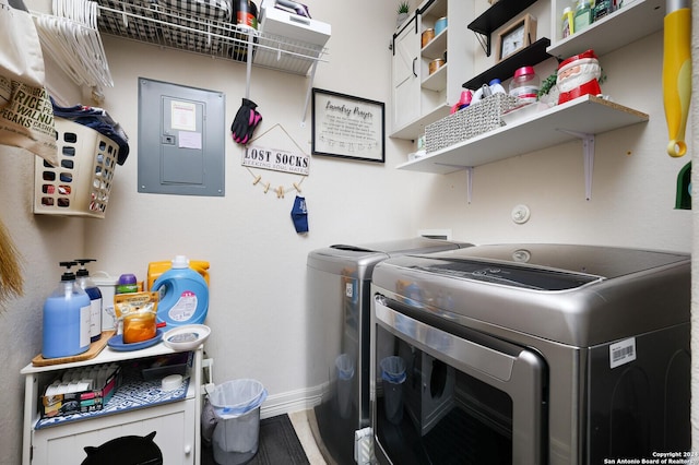 clothes washing area featuring washing machine and dryer and electric panel