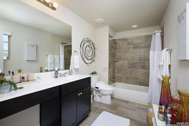 full bathroom featuring shower / bath combination with curtain, toilet, and vanity