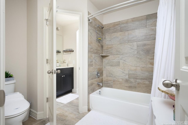 full bathroom featuring shower / tub combo, vanity, and toilet