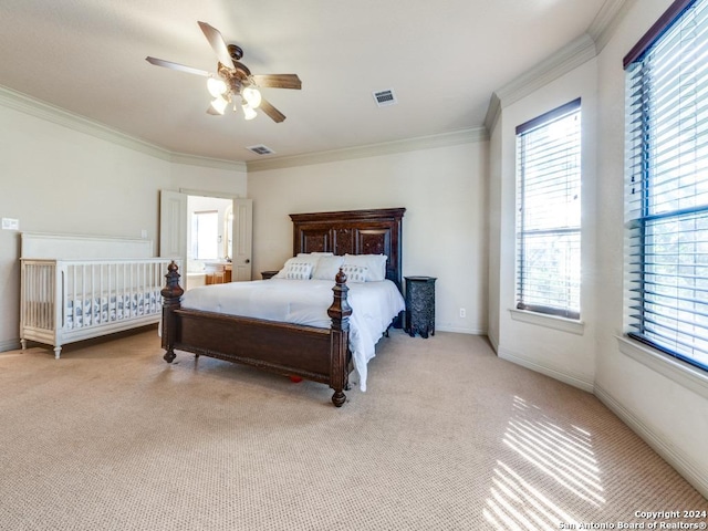 bedroom with visible vents, ornamental molding, carpet, baseboards, and ceiling fan