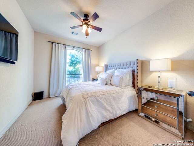 carpeted bedroom featuring ceiling fan