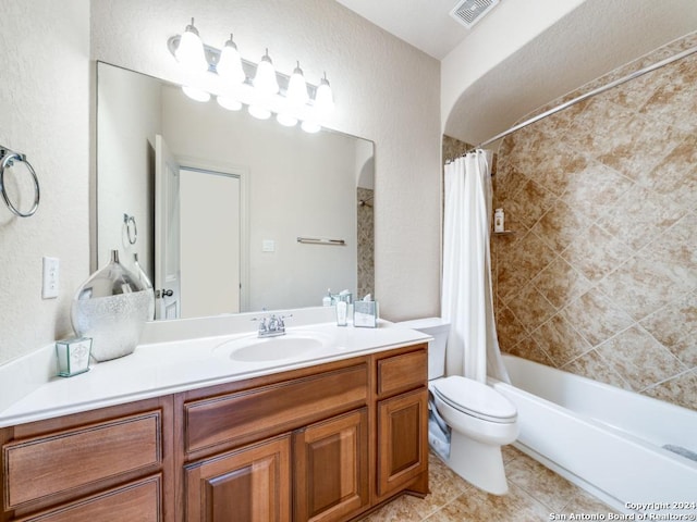 bathroom featuring tile patterned flooring, visible vents, toilet, shower / bath combo with shower curtain, and vanity