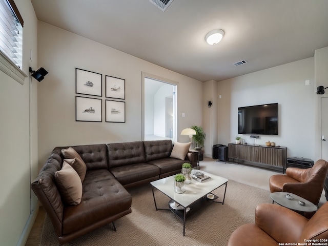 carpeted living area with visible vents